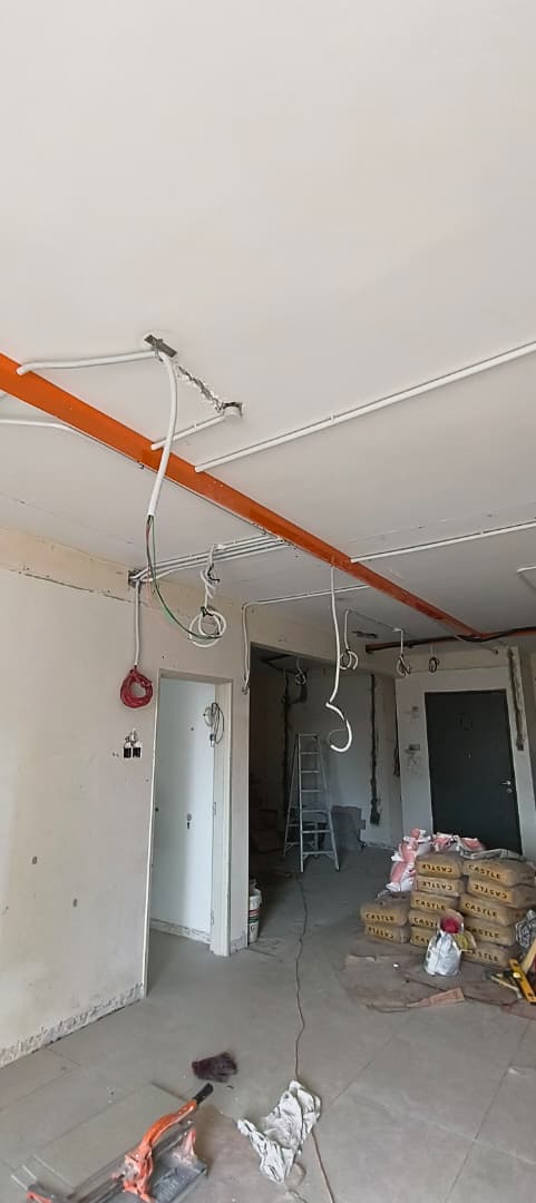 Shop lot rewiring with orange trunking